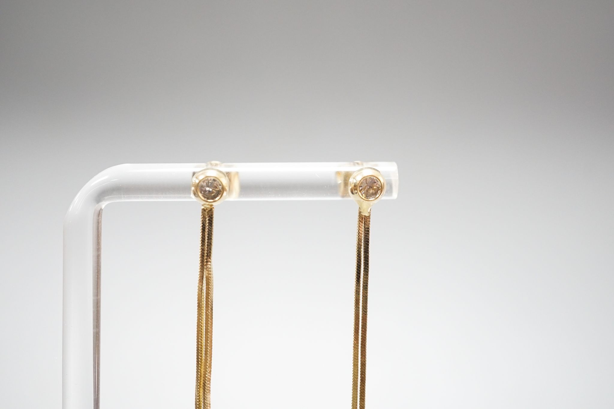 A pair of 585 yellow metal and white stone set tassel drop earrings, gross 4 grams